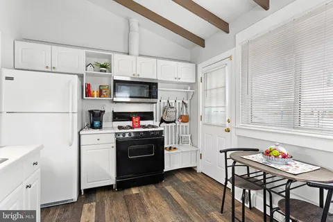 a kitchen with stainless steel appliances a refrigerator sink and cabinets