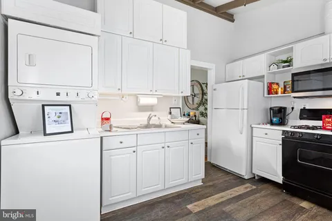 a bathroom with a sink a toilet and vanity