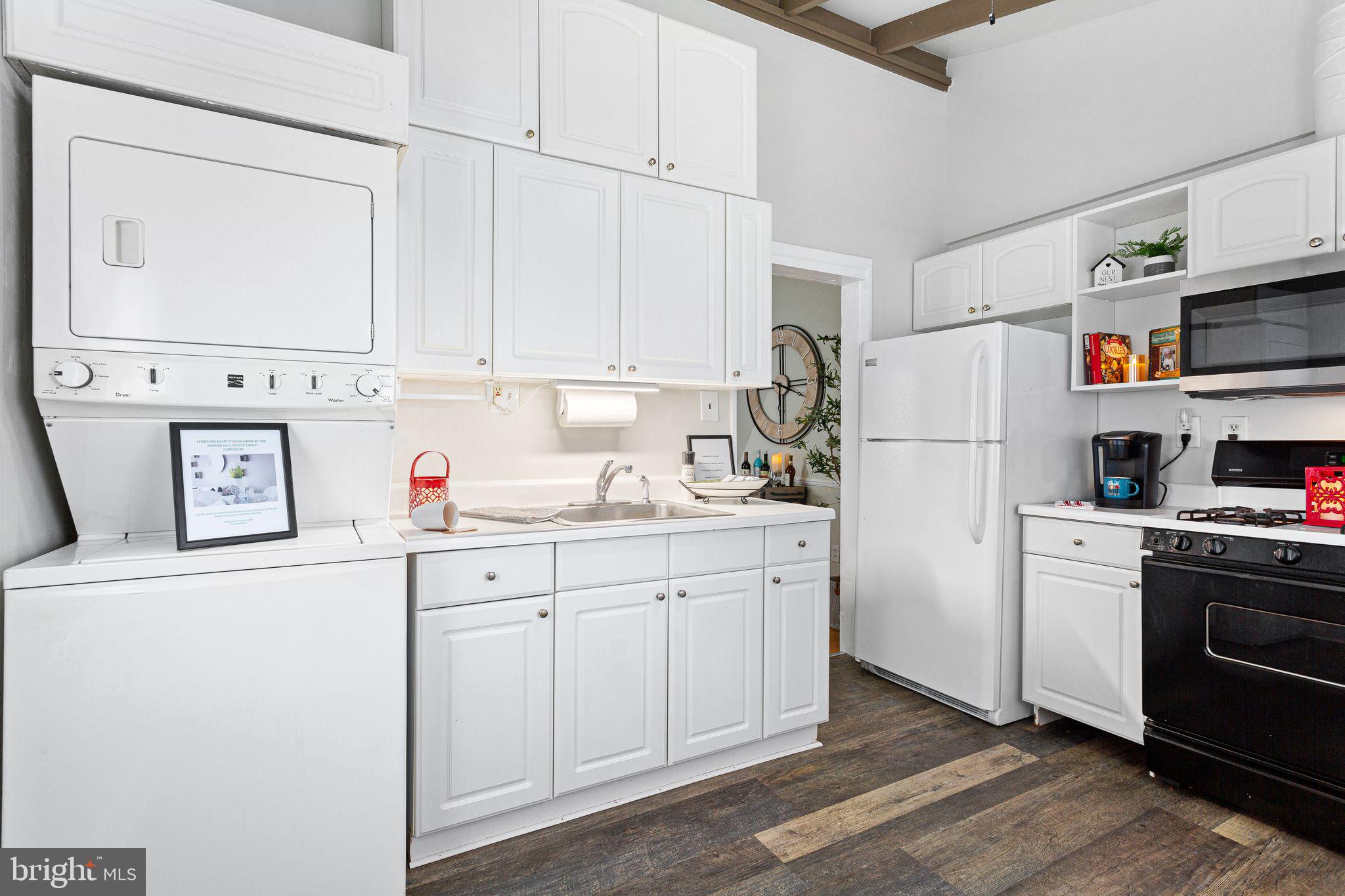110 Potter Street Haddonfield, NJ 08033 - Photo 17 of 48 a kitchen with stainless steel appliances a refrigerator sink and cabinets