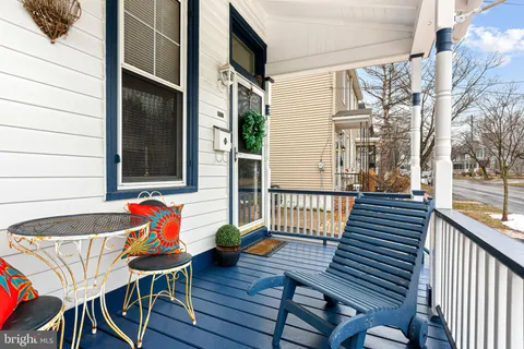 a balcony view with a seating space