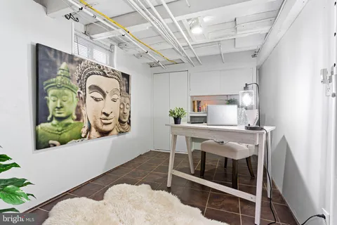 a view of a hallway with paintings on the wall