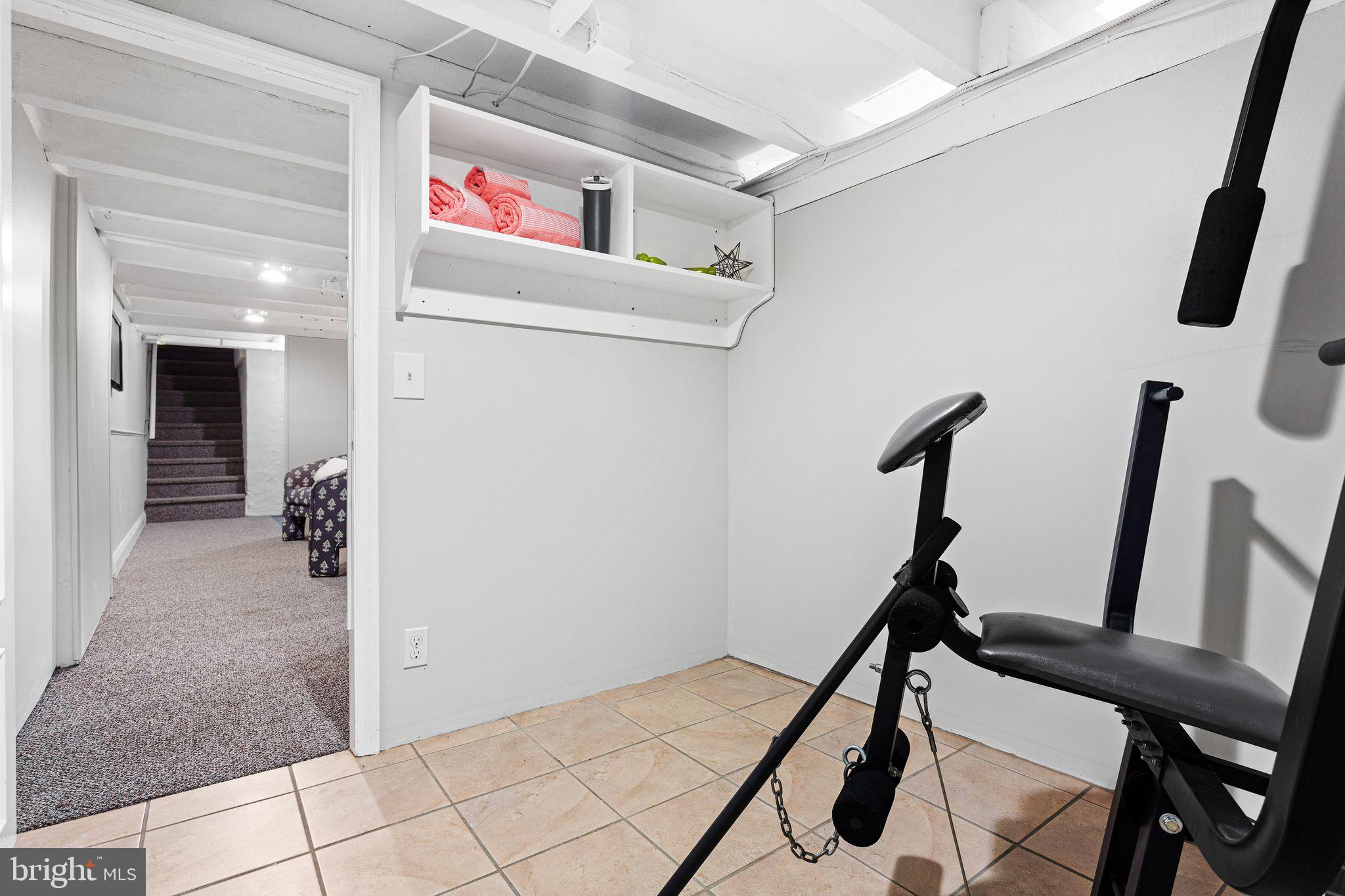 110 Potter Street Haddonfield, NJ 08033 - Photo 27 of 48 a view of a hallway with paintings on the wall