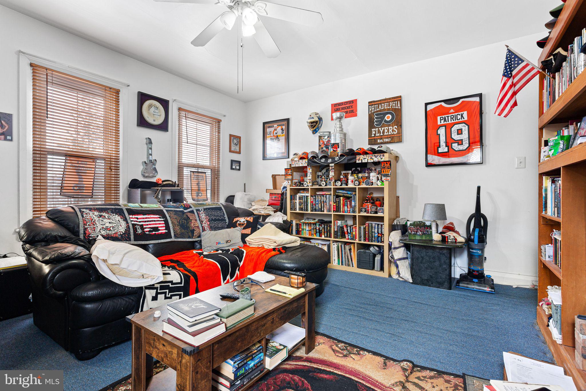 110 Potter Street Haddonfield, NJ 08033 - Photo 34 of 48 a living room with furniture and a bookshelf