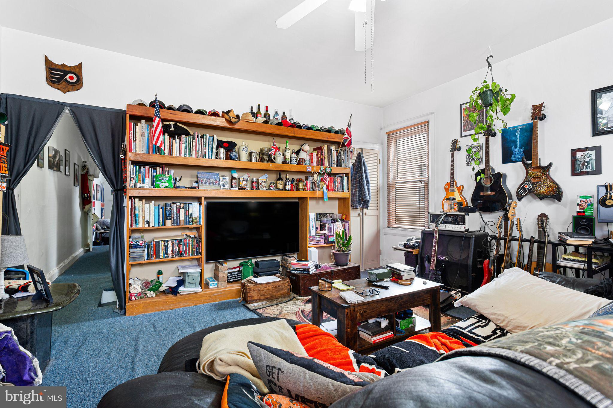 110 Potter Street Haddonfield, NJ 08033 - Photo 35 of 48 a living room with furniture fireplace and a flat screen tv