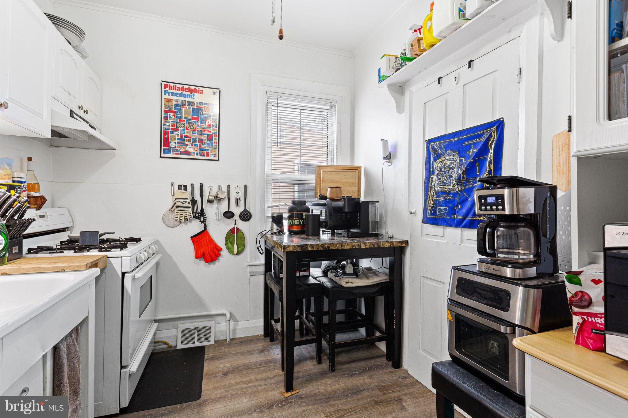 110 Potter Street Haddonfield, NJ 08033 - Photo 39 of 48 a room with stainless steel appliances a stove a refrigerator a sink a stove and white cabinets