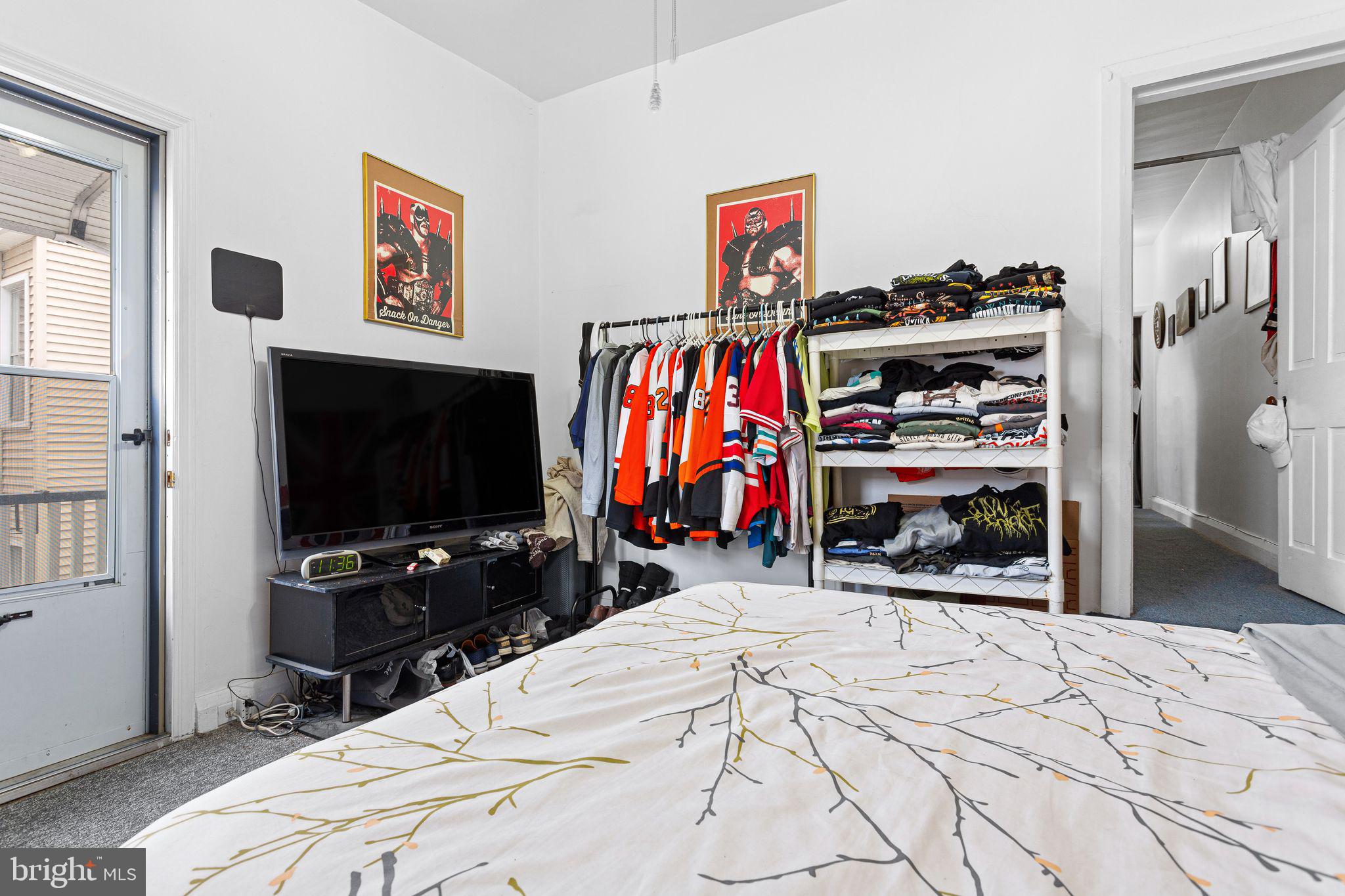 110 Potter Street Haddonfield, NJ 08033 - Photo 43 of 48 a bedroom with a bed and a flat screen tv