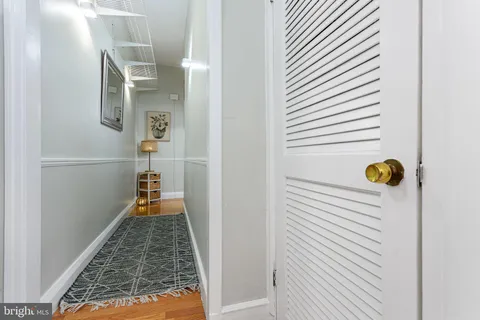 a bed room with a bed and a chair