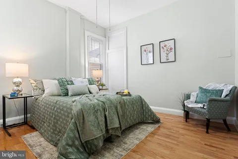 a bedroom with bed and a window