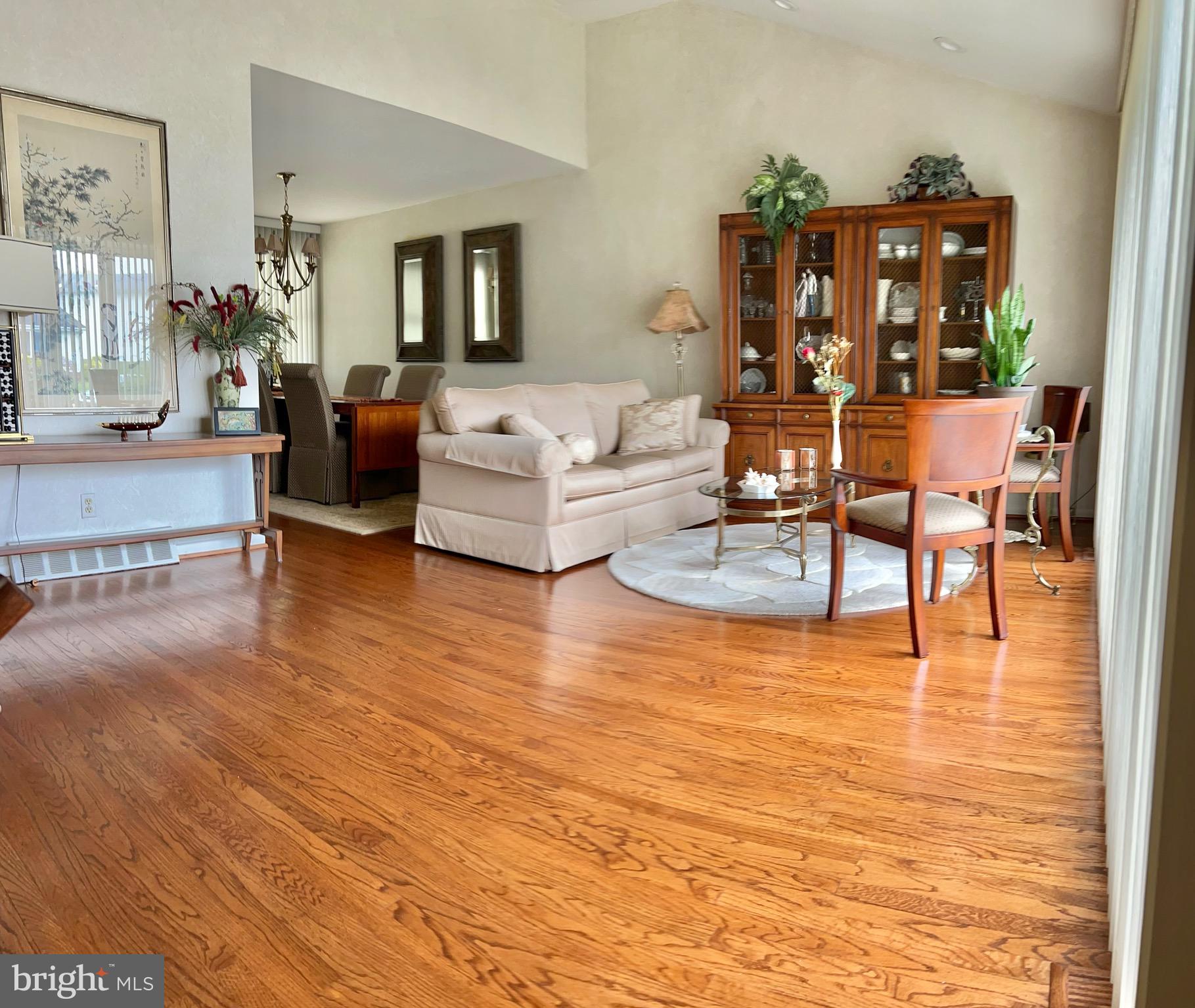 1017 Alpena Road Philadelphia, PA 19115 - Photo 3 of 30 a living room with fireplace furniture and a wooden floor