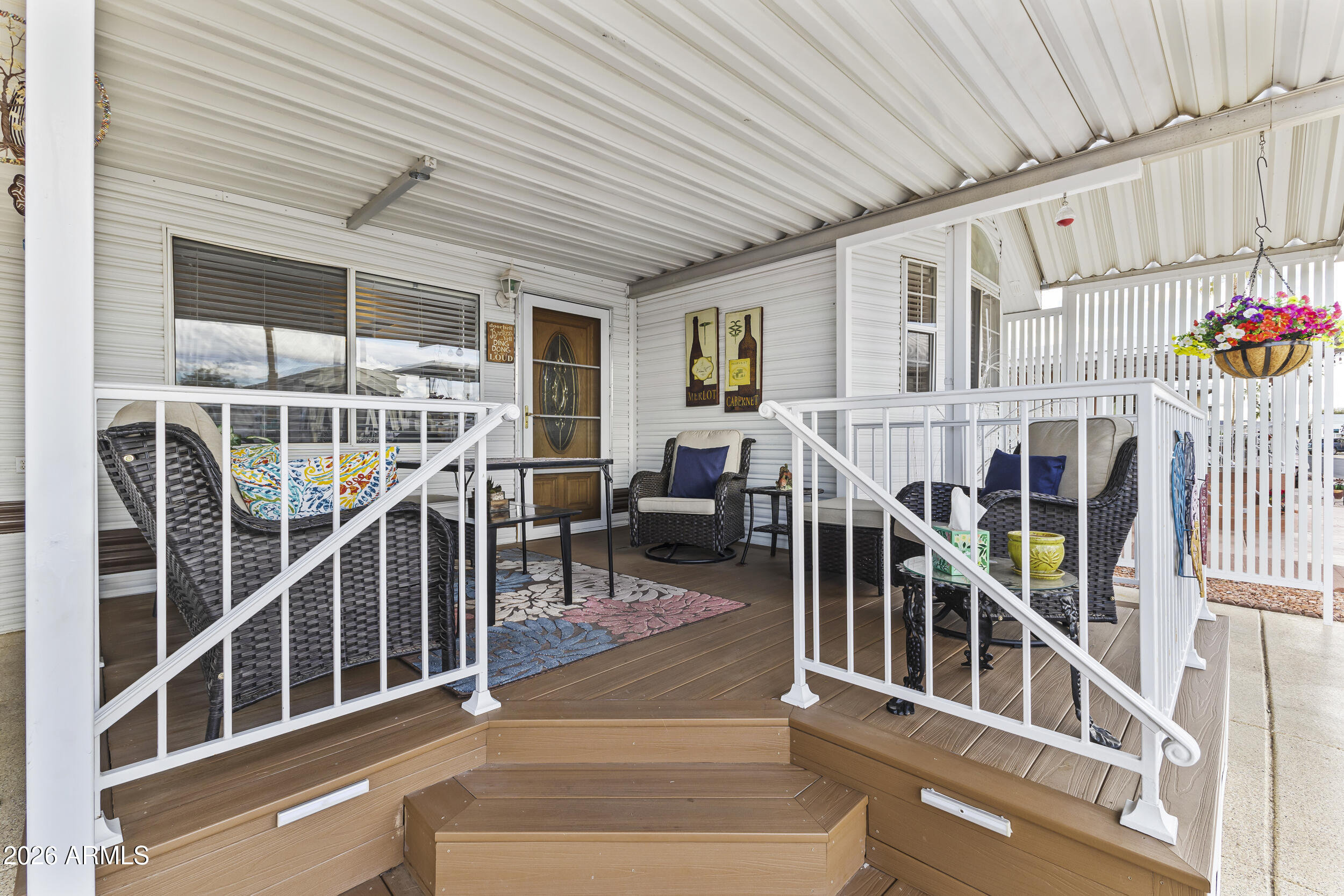 17200 West Bell Road, Unit 548 Surprise, AZ 85374 - Photo 4 of 19 a view of staircase with railing and white walls