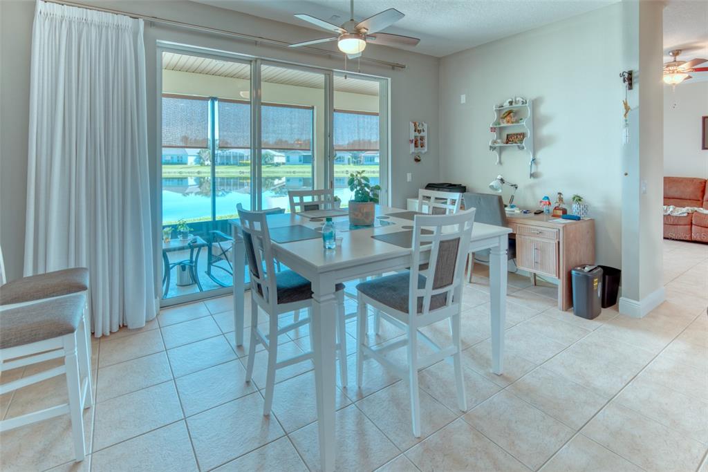 729 Glendora Road Kissimmee, FL 34759 - Photo 11 of 56 a view of a dining room with furniture and a window