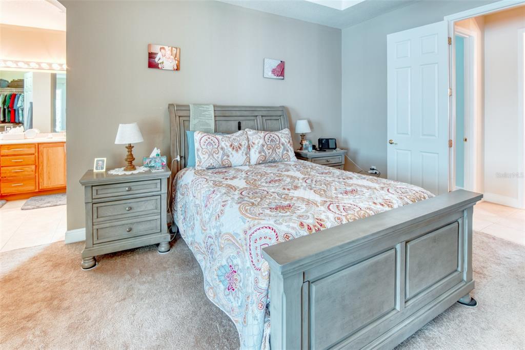 729 Glendora Road Kissimmee, FL 34759 - Photo 26 of 56 a bedroom with a bed and a cabinets