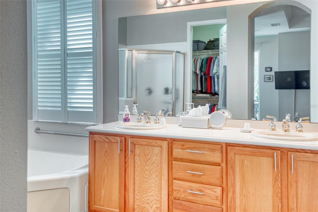 729 Glendora Road Kissimmee, FL 34759 - Photo 28 of 56 a bathroom with a sink and a mirror