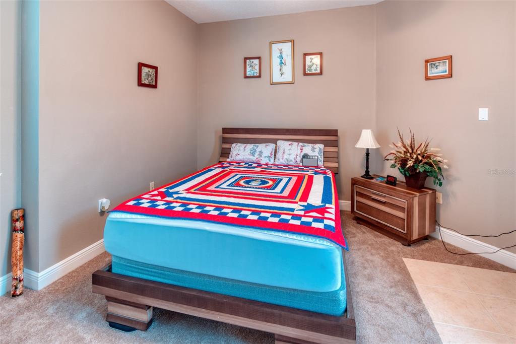 729 Glendora Road Kissimmee, FL 34759 - Photo 41 of 56 a bedroom with a bed and a dresser