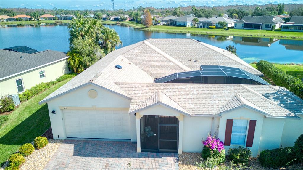 729 Glendora Road Kissimmee, FL 34759 - Photo 45 of 56 a aerial view of a house with swimming pool and outdoor seating