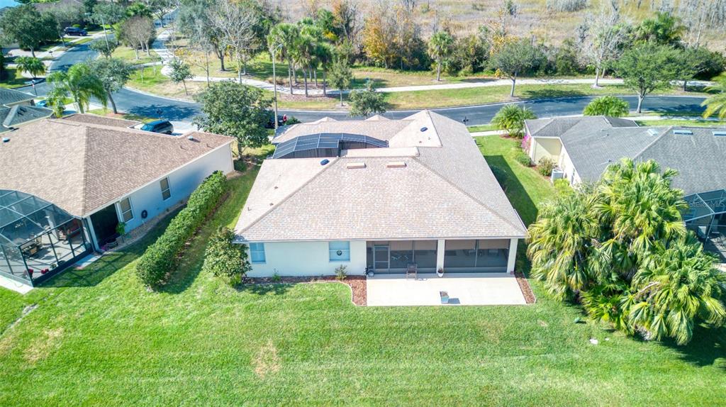 729 Glendora Road Kissimmee, FL 34759 - Photo 48 of 56 a aerial view of a house with swimming pool and a yard