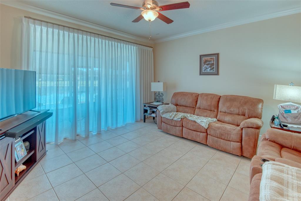 729 Glendora Road Kissimmee, FL 34759 - Photo 7 of 56 a living room with furniture and a fireplace