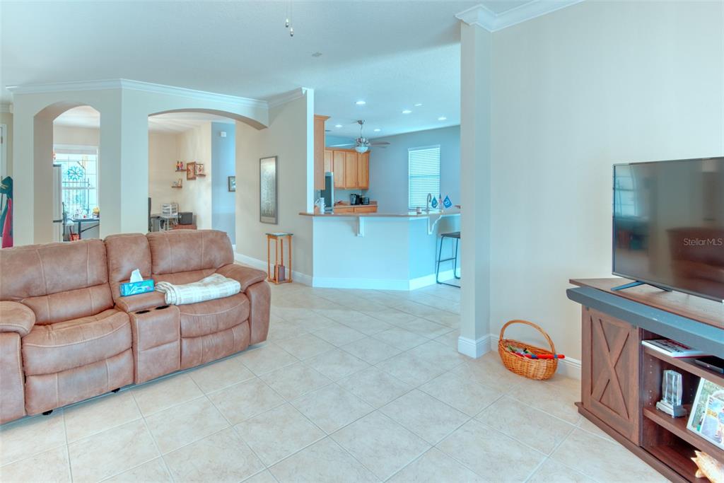 729 Glendora Road Kissimmee, FL 34759 - Photo 8 of 56 a living room with furniture and a flat screen tv