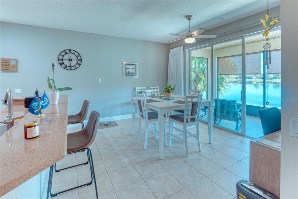 729 Glendora Road Kissimmee, FL 34759 - Photo 9 of 56 a dining room with furniture and a large window