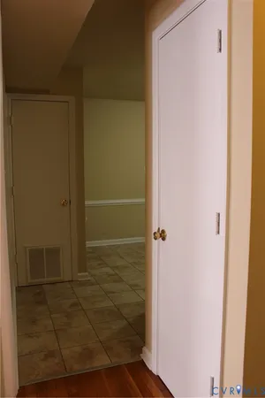 a kitchen with stainless steel appliances granite countertop wood cabinets a sink and a window