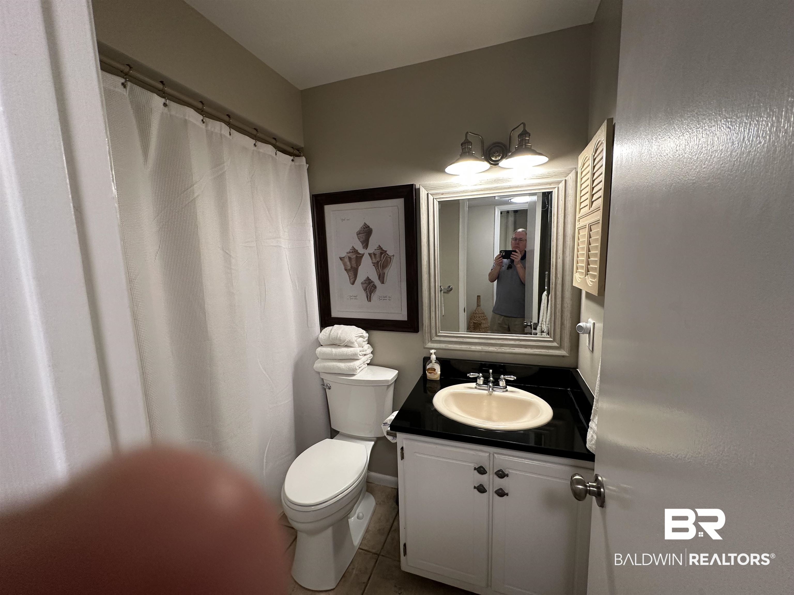 400 Plantation Road, Unit 2202 Gulf Shores, AL 36542 - Photo 23 of 26 Bathroom with a shower with curtain, vanity, and tile patterned flooring