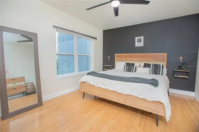 a bedroom with a bed and a window