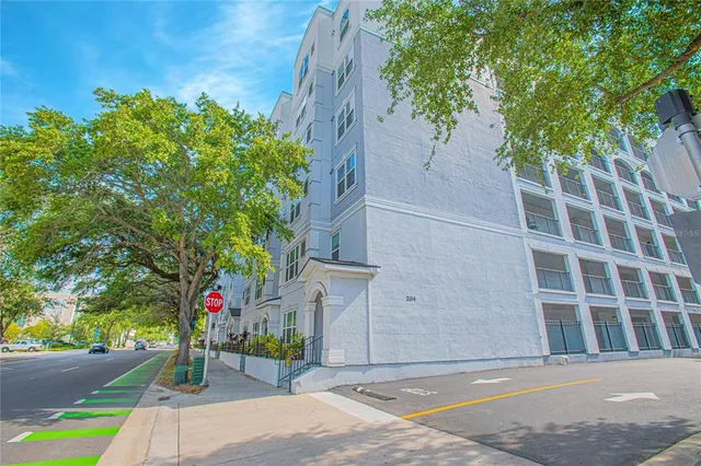 a front view of a building with tree s