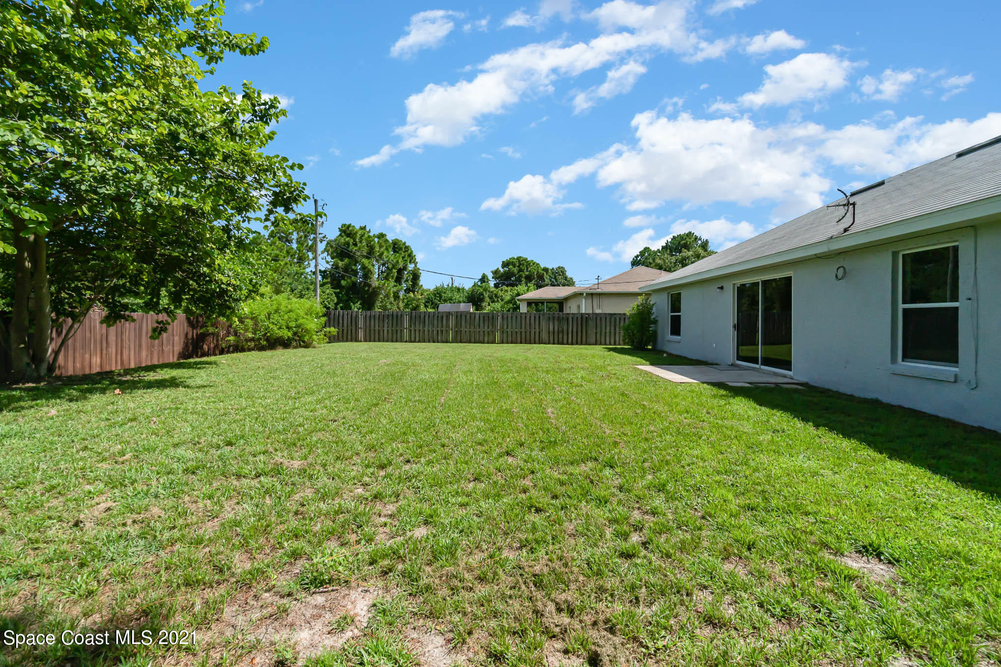 1380 Ran Road Southeast Palm Bay, FL 32909 - Photo 20 of 20 a backyard of a house with lots of green space