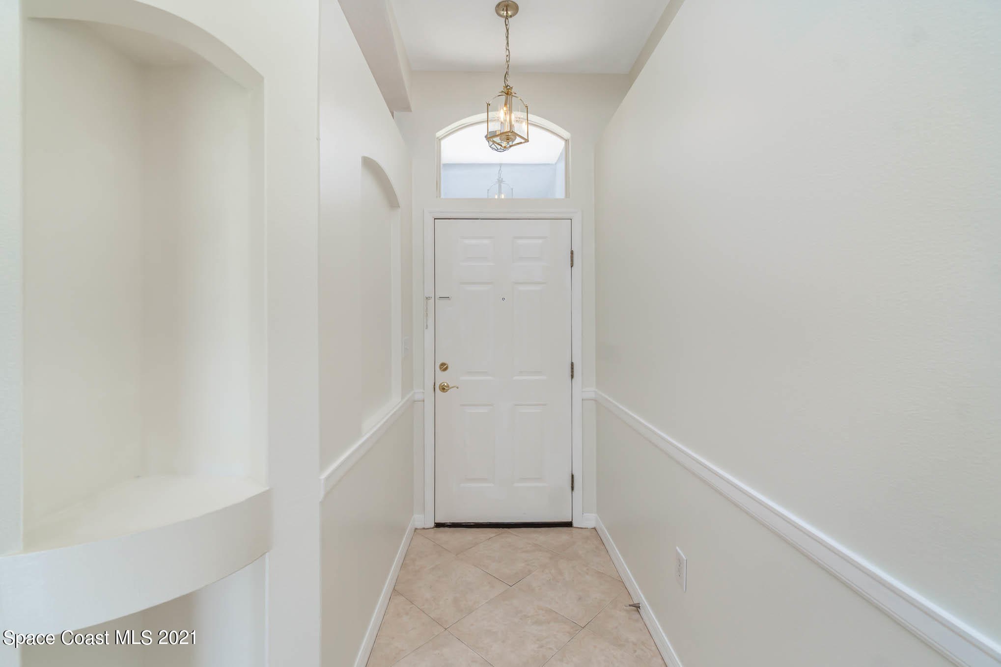 1380 Ran Road Southeast Palm Bay, FL 32909 - Photo 4 of 20 a view of a hallway with window