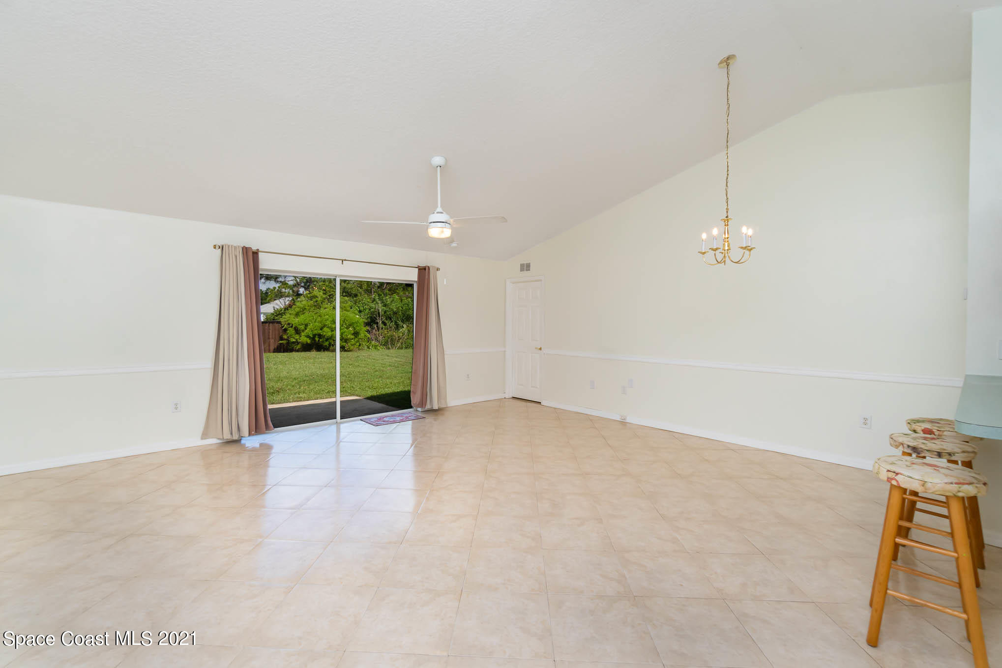 1380 Ran Road Southeast Palm Bay, FL 32909 - Photo 5 of 20 a view of an empty room with a window