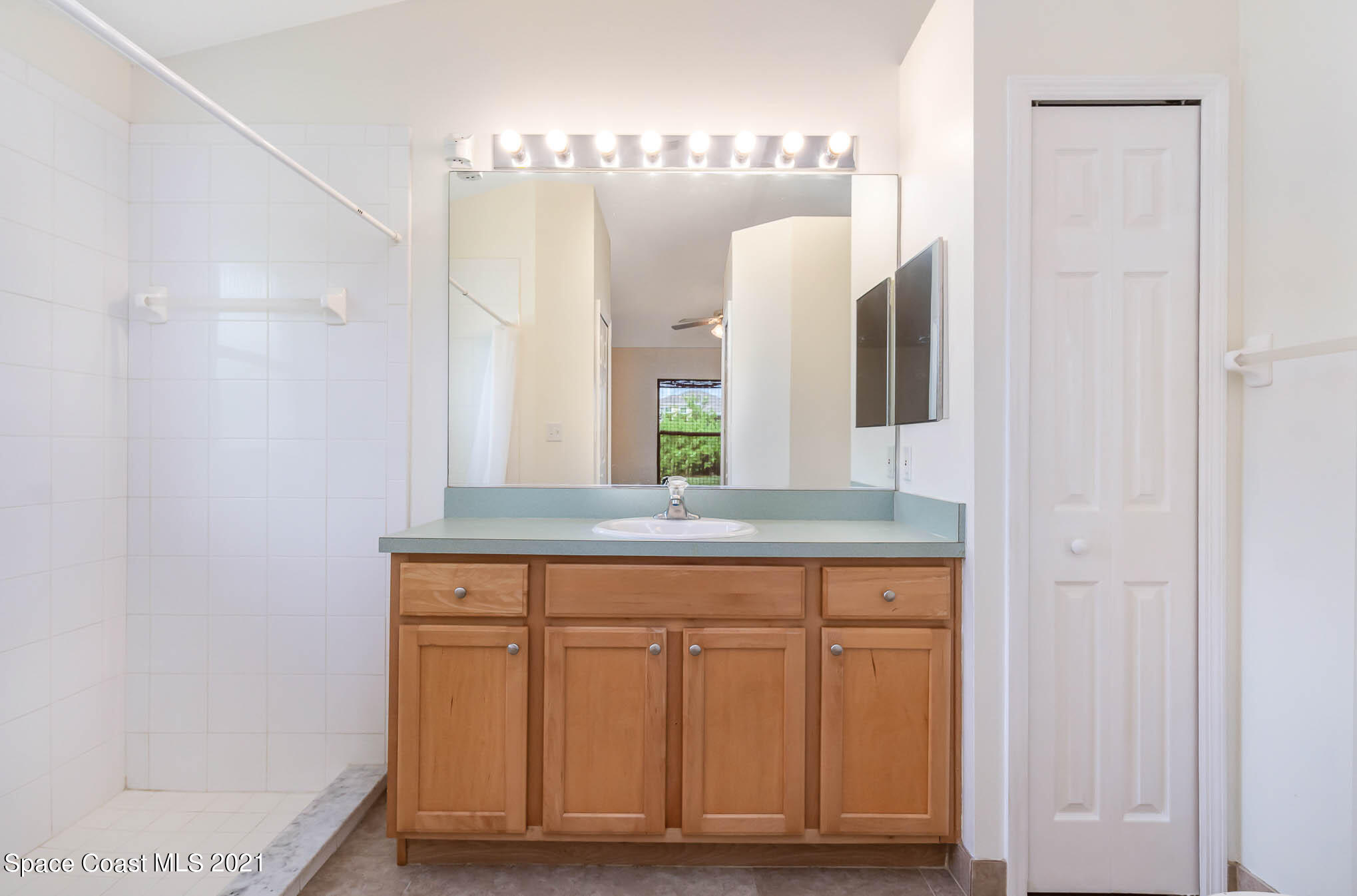 1380 Ran Road Southeast Palm Bay, FL 32909 - Photo 7 of 20 a bathroom with a sink and a mirror