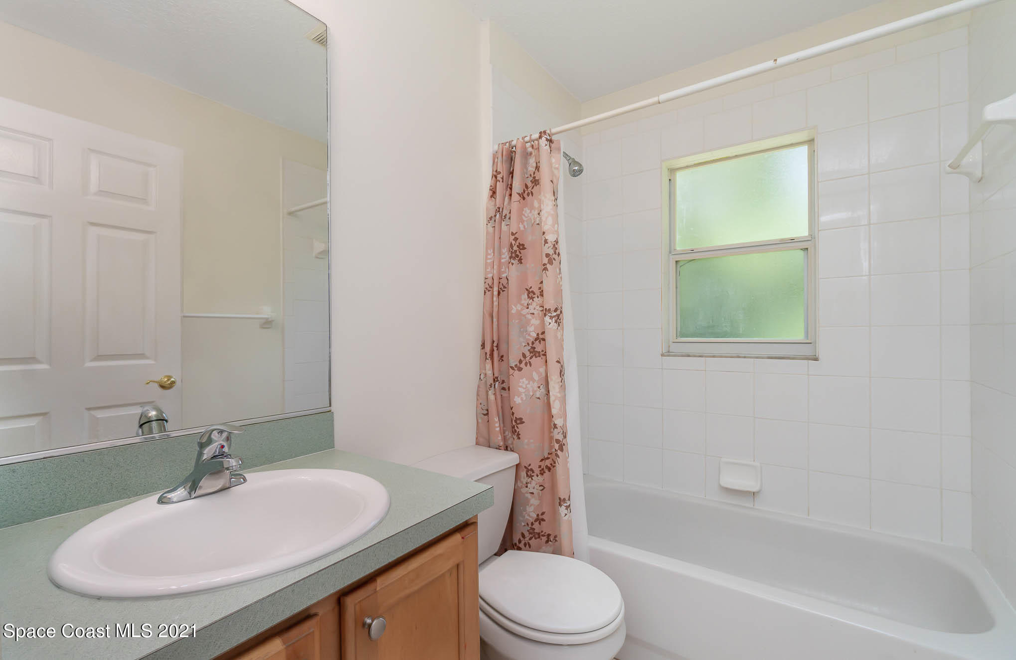 1380 Ran Road Southeast Palm Bay, FL 32909 - Photo 10 of 20 a bathroom with a sink toilet and shower