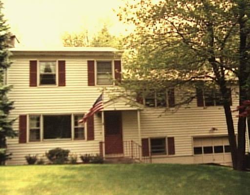 9 Robinhood Road Danbury, CT 06811 - Photo 1 of 1 a front view of house with yard