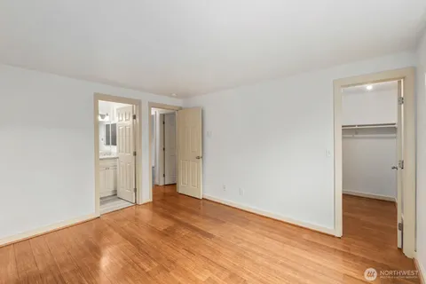 a view of an empty room and wooden floor