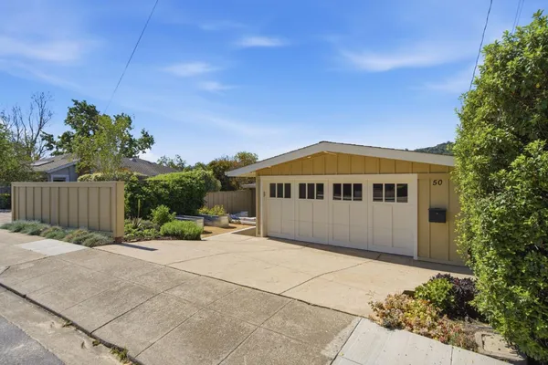a house view with a garden space