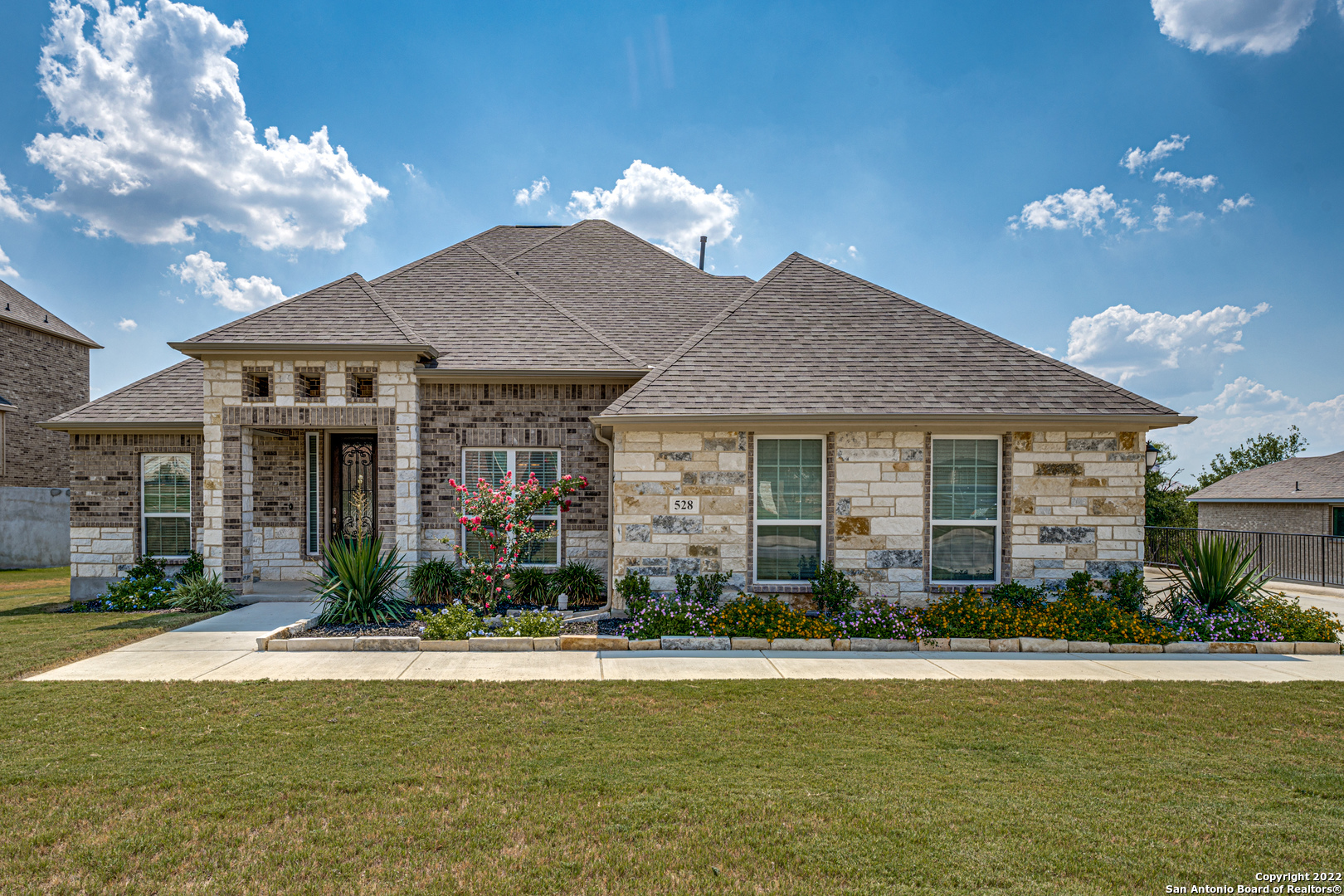 528 Lilly Bluff Castroville, TX 78009 - Photo 1 of 1 a front view of a house with swimming pool