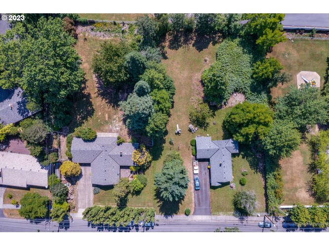 an aerial view of lake house and outdoor space