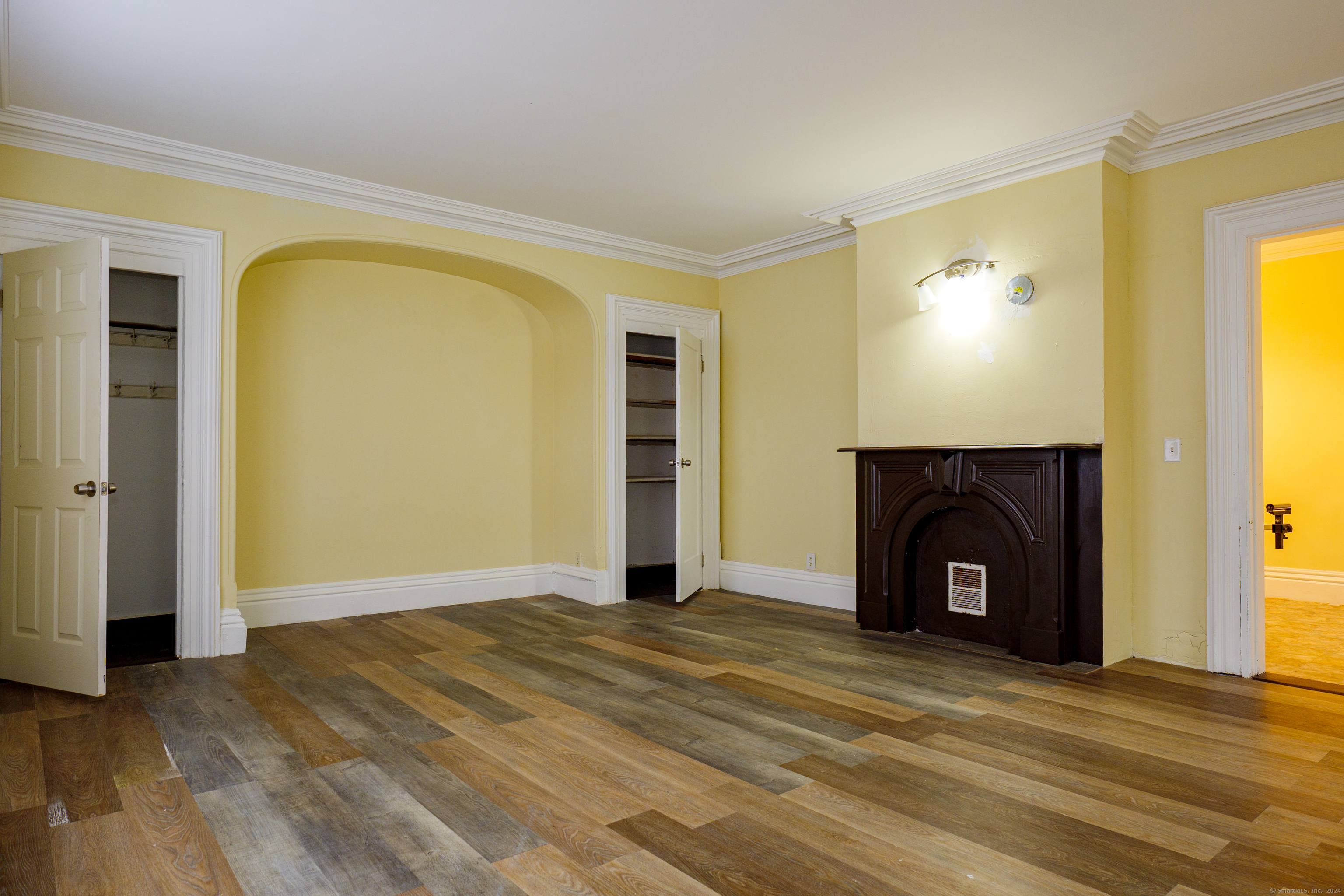 30 Main Street Plainfield, CT 06332 - Photo 12 of 16 a view of empty room with a fireplace and wooden floor