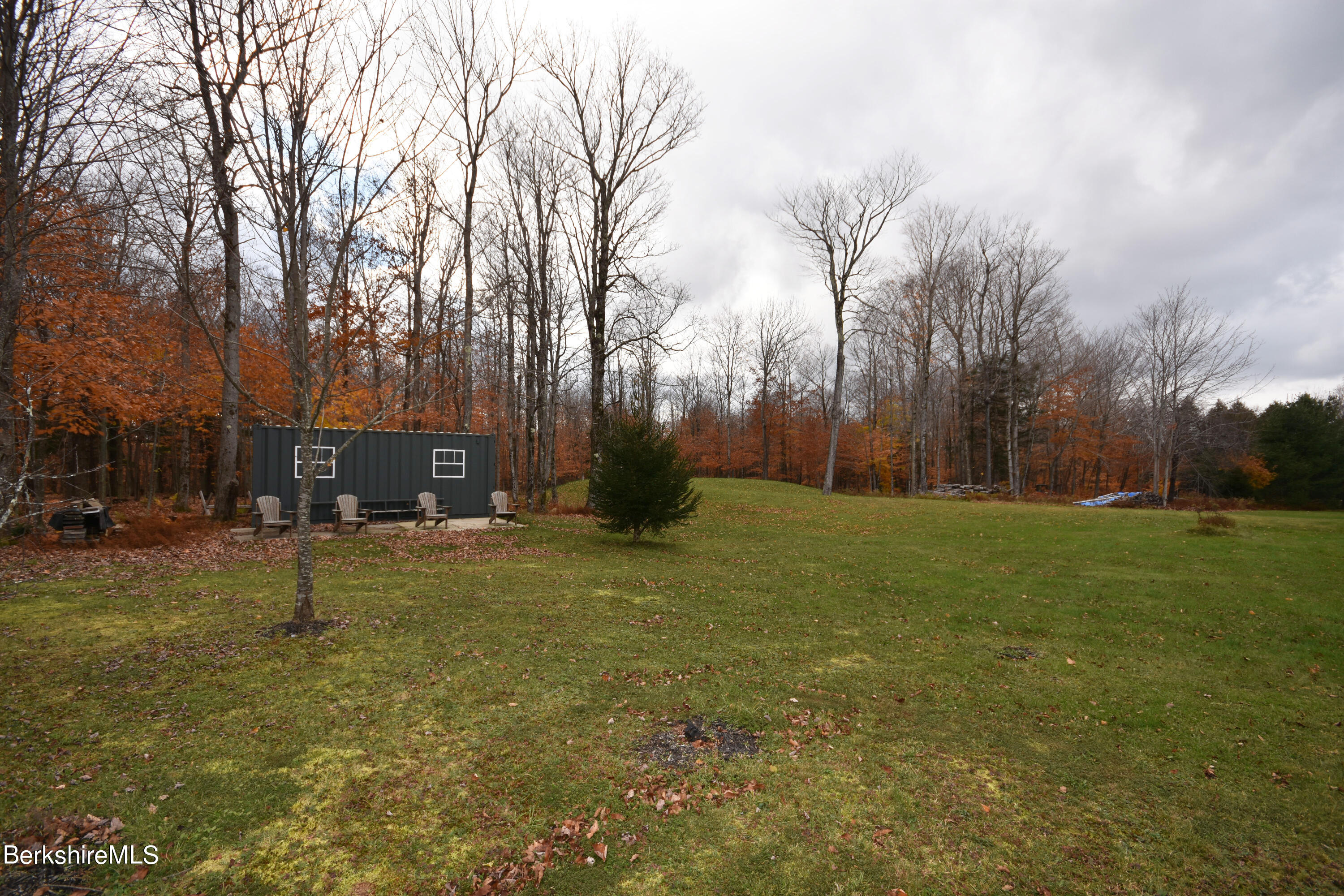 1240 Main Road Savoy, MA 01256 - Photo 50 of 55 a backyard of apartments with large trees