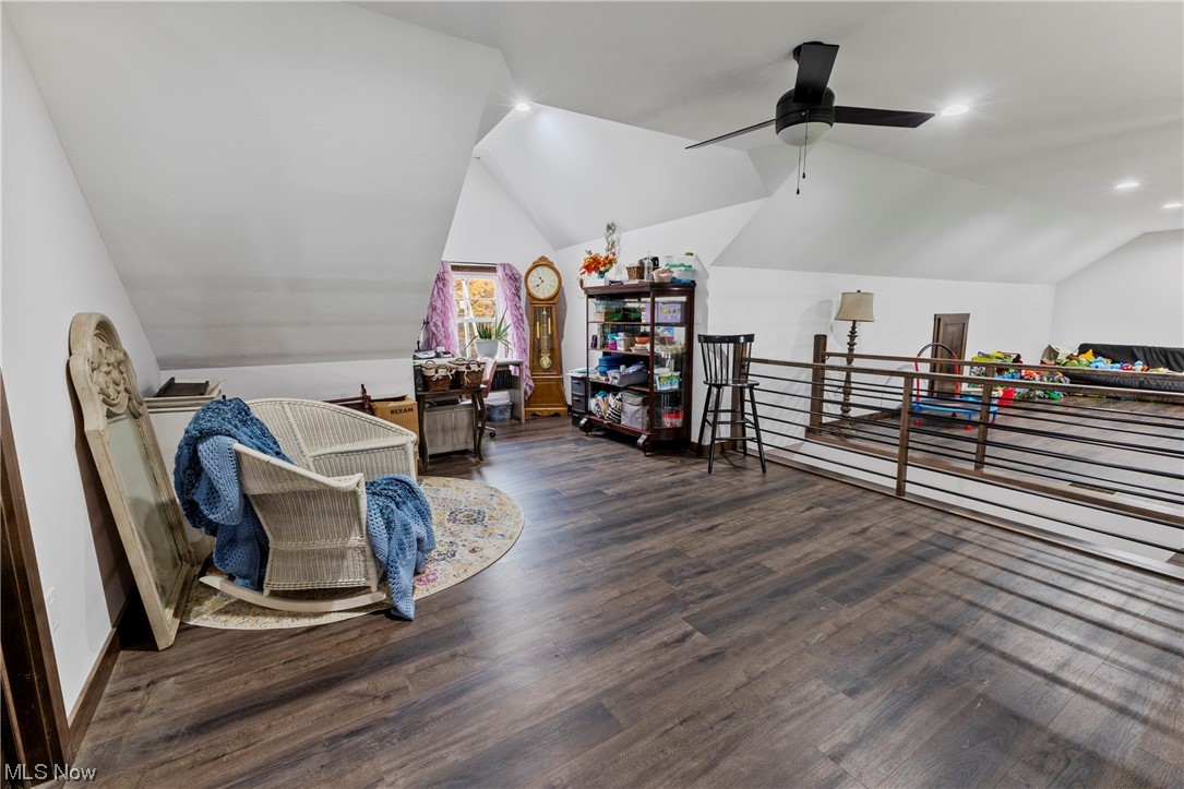 45588 County Road Cadiz, OH 43907 - Photo 20 of 35 Sitting room/ office in the loft, with vaulted ceiling, ceiling fan, and dark hardwood / wood-style floors.