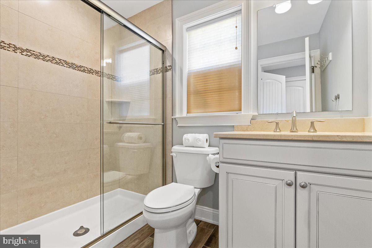 8 Harris Road Princeton, NJ 08540 - Photo 15 of 25 a bathroom with a sink a toilet and shower