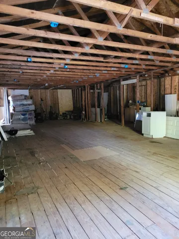 a view of a room with wooden roof