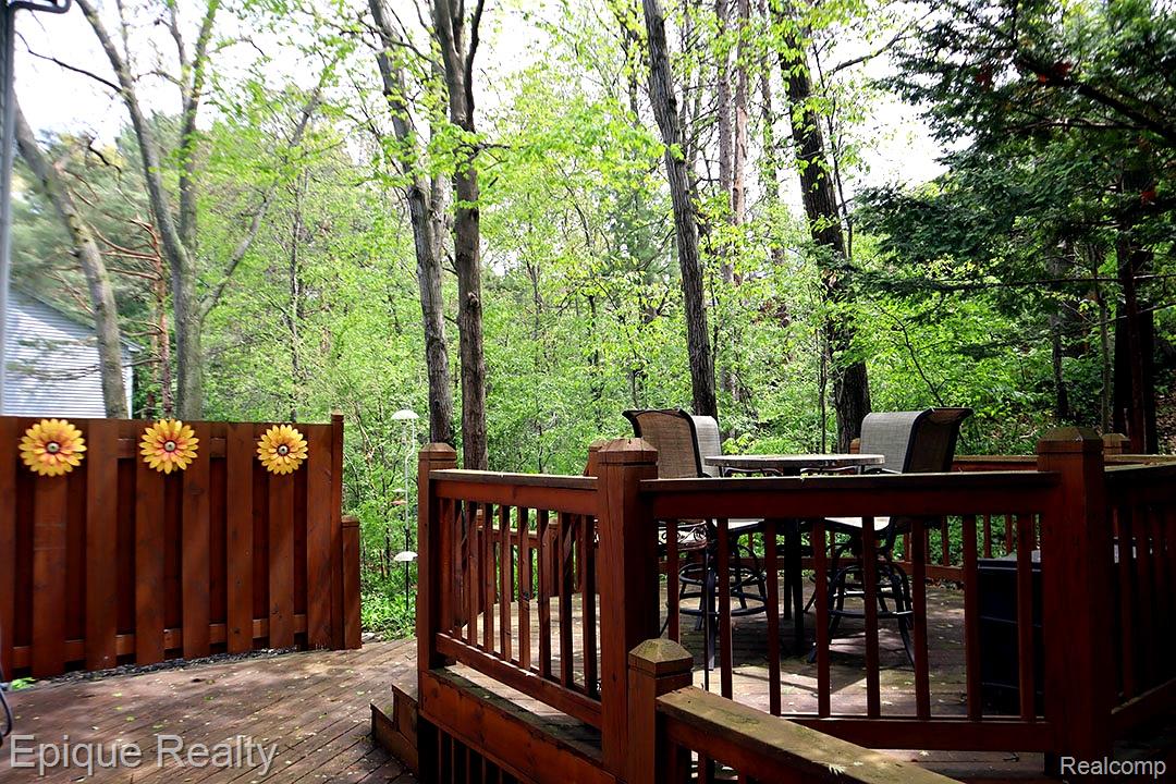 6607 Ridgeview Drive Clarkston, MI 48346 - Photo 4 of 25 Wooden terrace featuring outdoor dining area