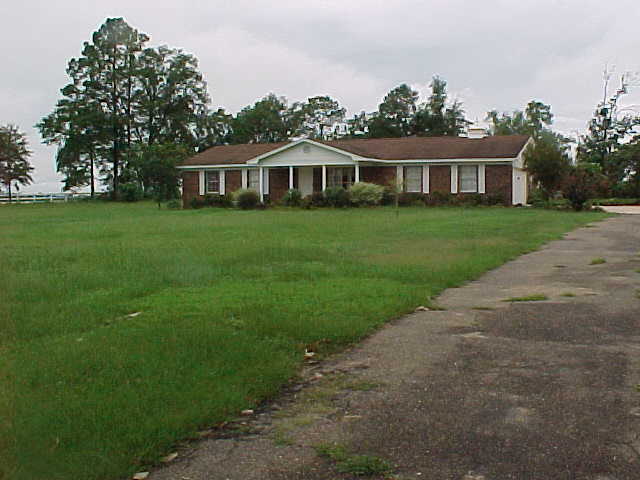 5708 Griffith Mill Road Baker, FL 32531 - Photo 1 of 1 a front view of a house with a yard