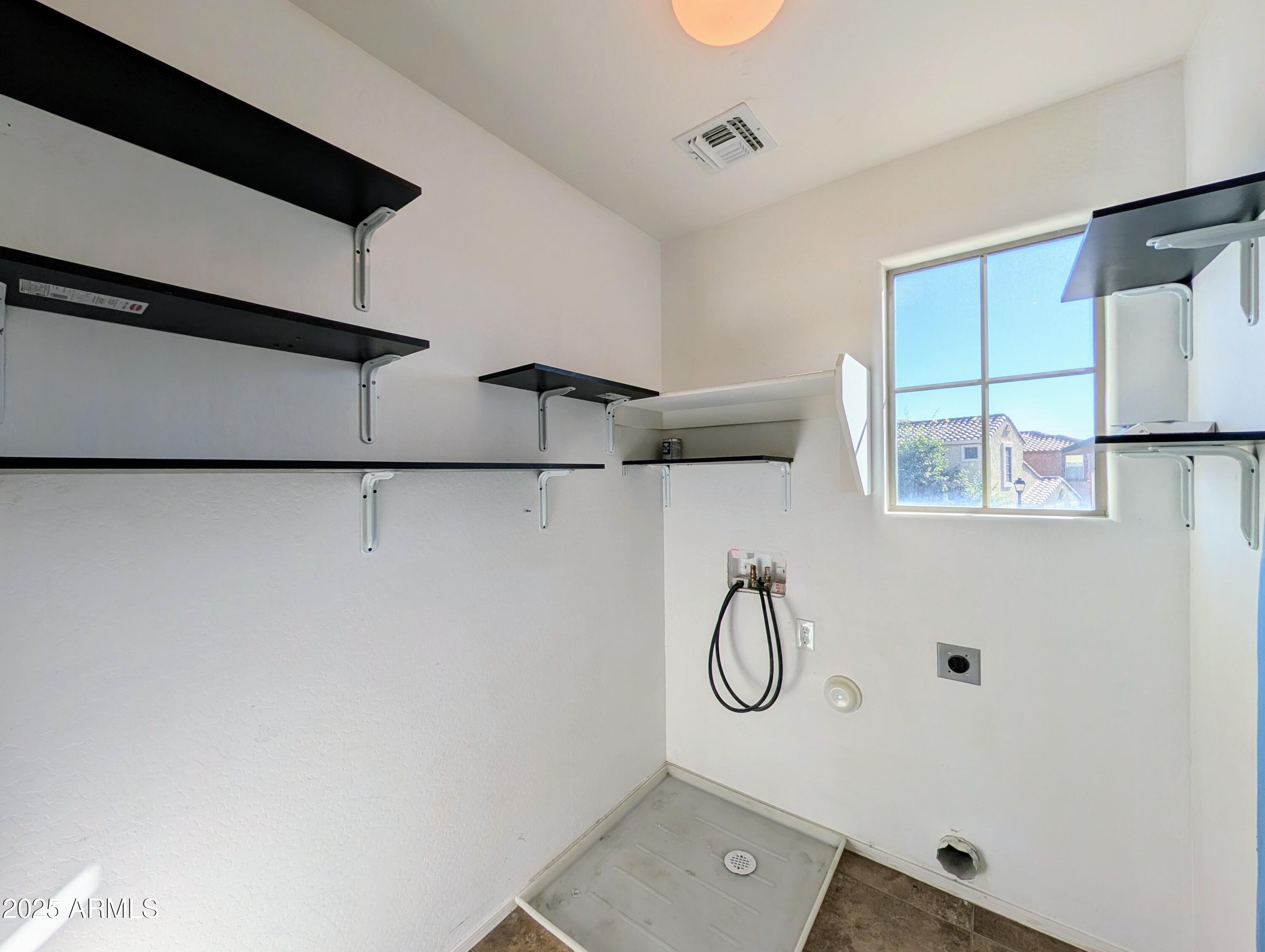 4726 West Fremont Rd. Laveen, AZ 85339 - Photo 37 of 50 a bathroom with a glass shower door