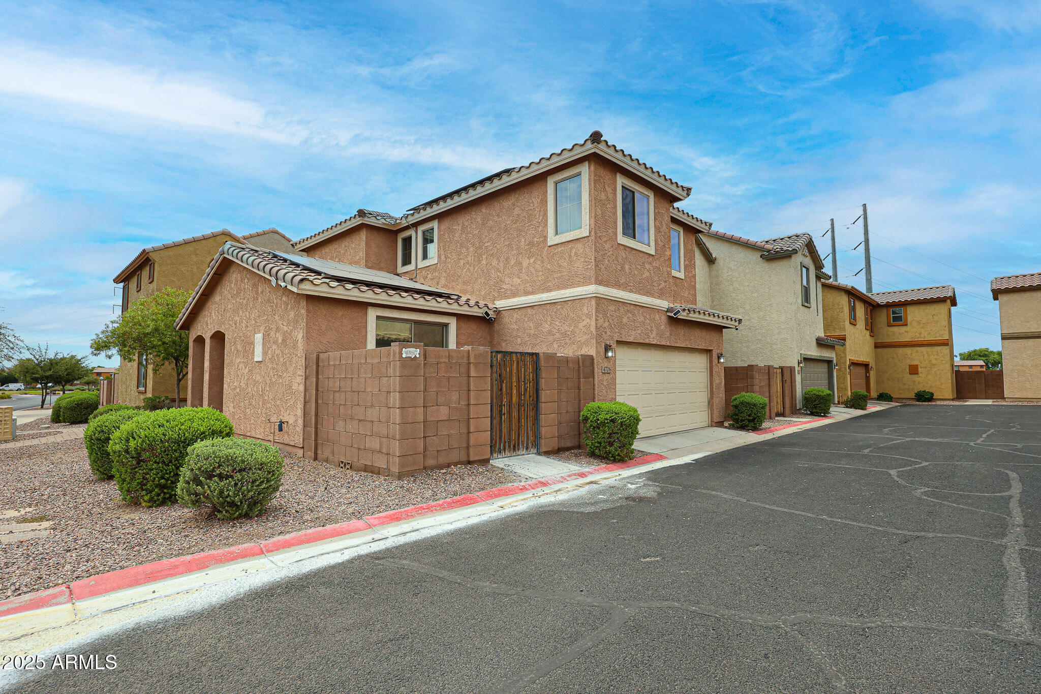 4726 West Fremont Rd. Laveen, AZ 85339 - Photo 48 of 50 a front view of a house with a yard and garage