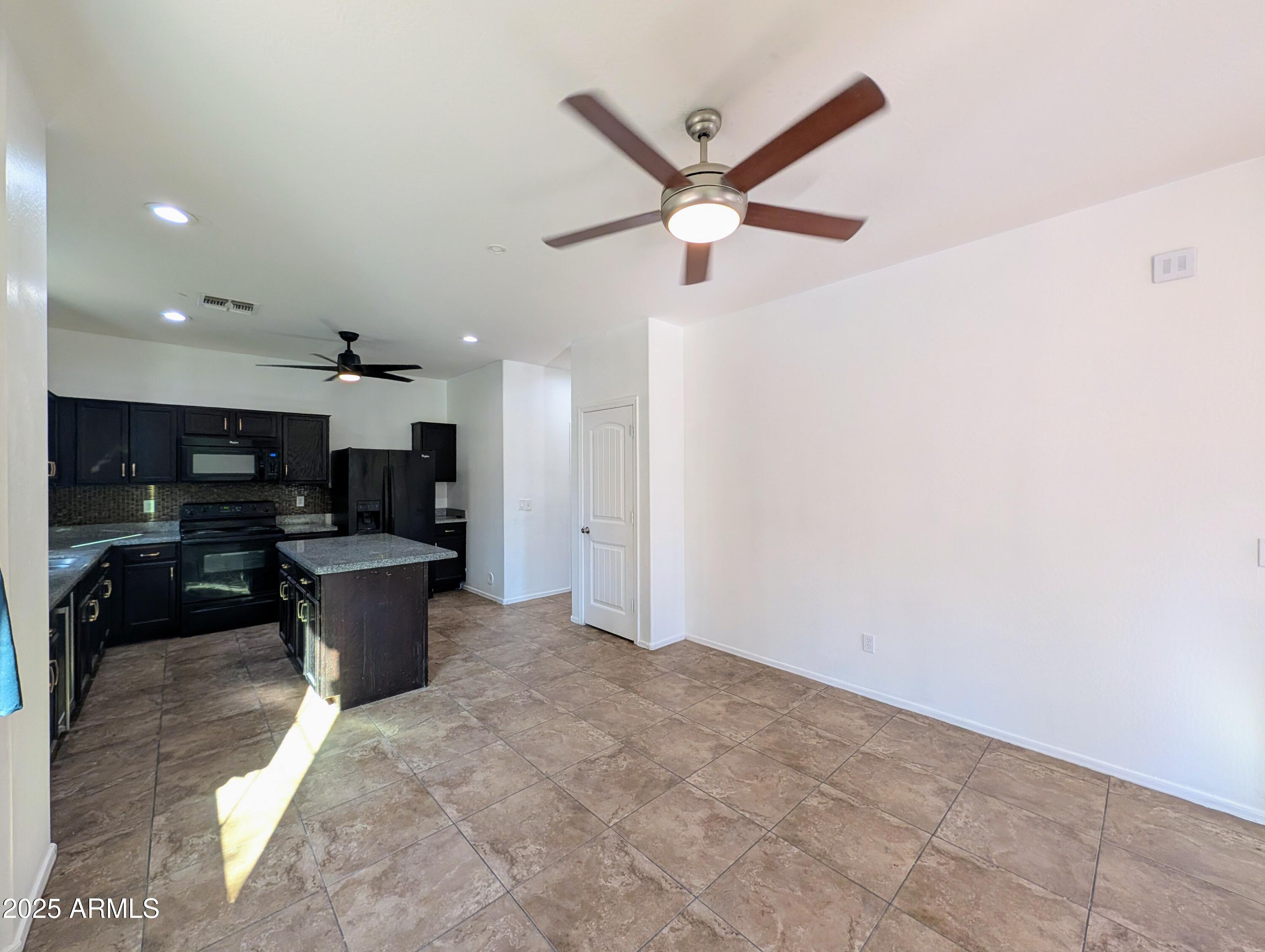 4726 West Fremont Rd. Laveen, AZ 85339 - Photo 6 of 50 a view of a kitchen with a sink and microwave