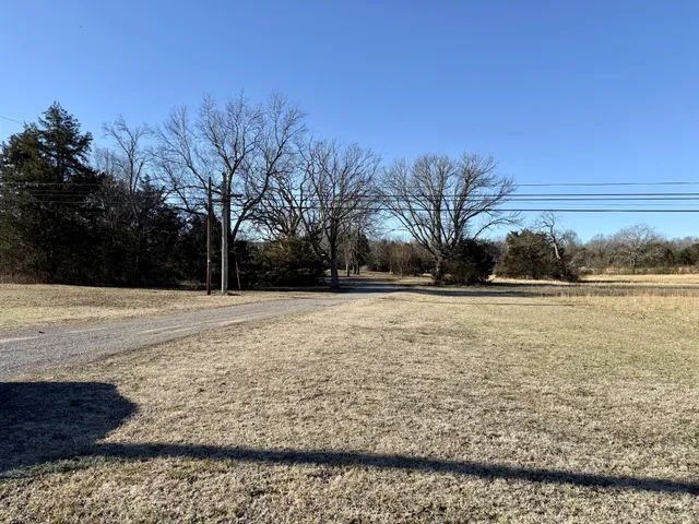 a view of lake with yard