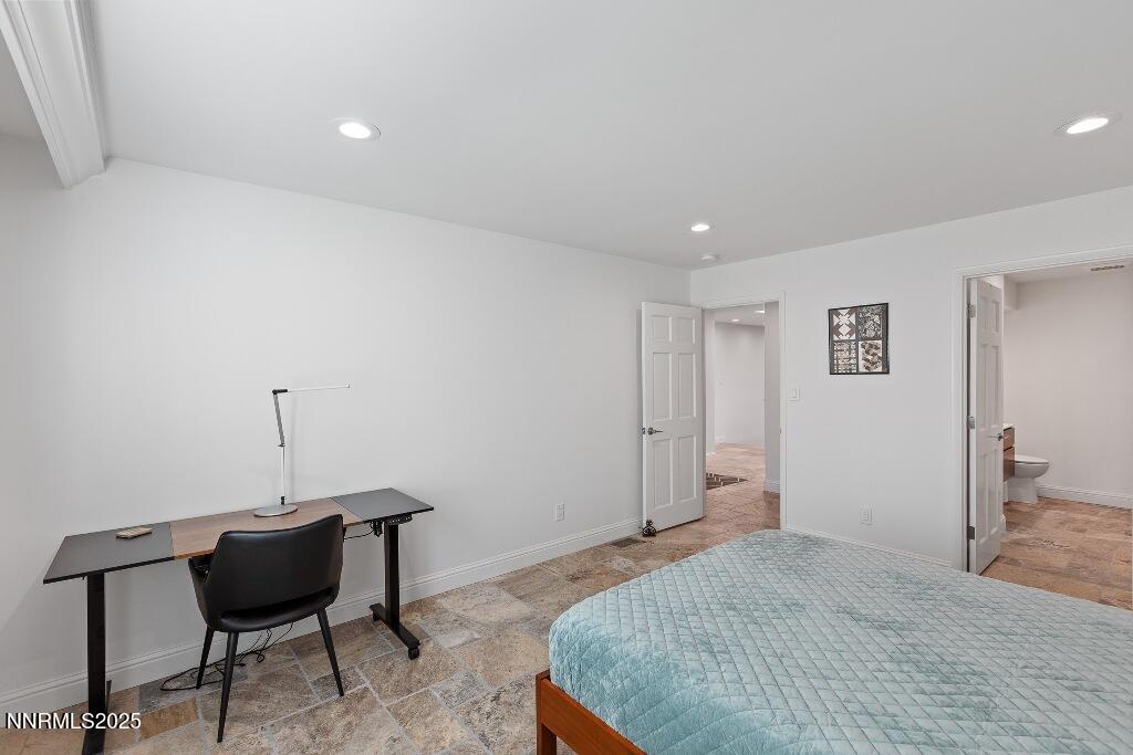 4811 Lakeridge Terrace West Reno, NV 89509 - Photo 32 of 43 a bedroom with bed and chair