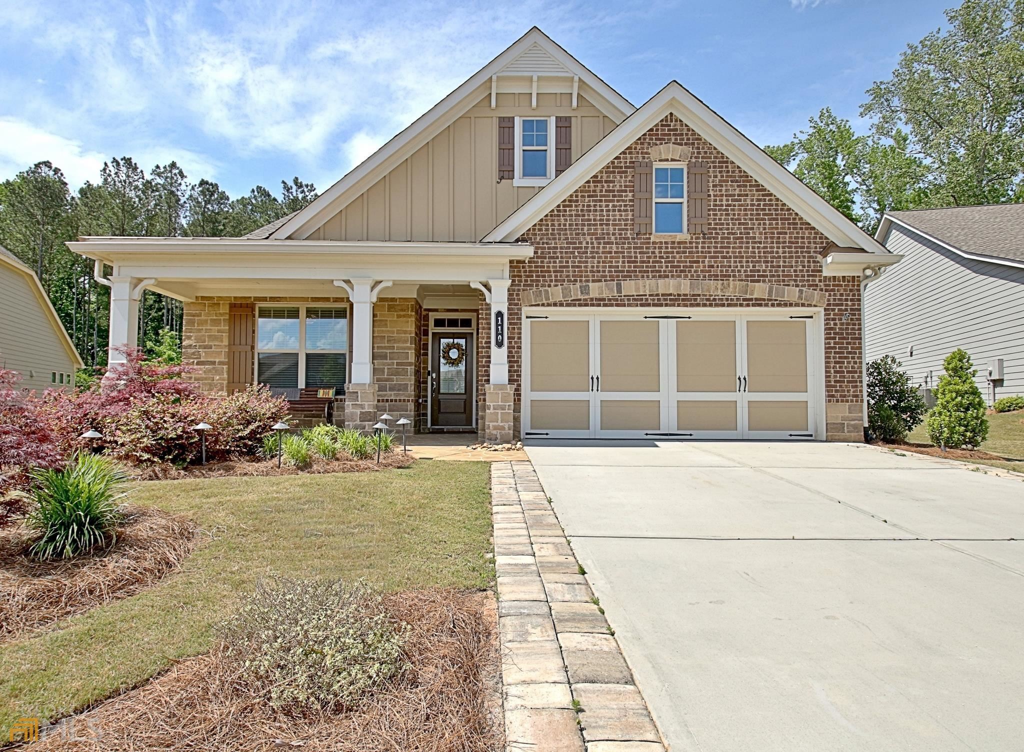 110 Timberview Circle Sharpsburg, GA 30277 - Photo 1 of 1 a front view of a house with a yard and potted plants